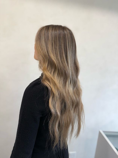 Long blonde balayage painted by hand at Shade Studio in Long Branch, New Jersey