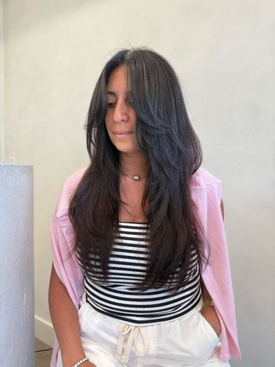 Long dark straight color with an even tone from root to end at Shade Studio in Long Branch, New Jersey