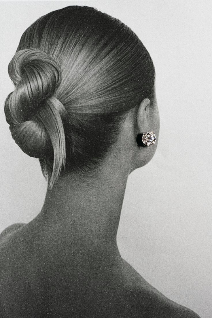 Sleek low chignon bridal updo at Shade Studio in Long Branch, New Jersey